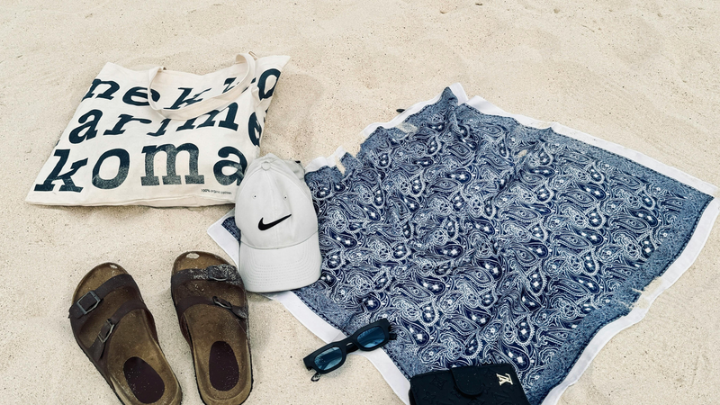 Photo by Cristian Jay Viray. Beach-essentials-on-sandy-shoreline